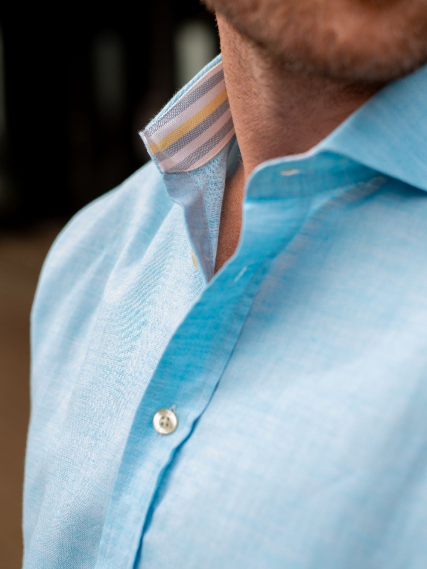 Close-up of a light blue shirt with a blurred background